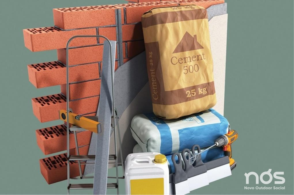 Materiais de construção: tijolos, saco de cimento, escada e ferramentas. Capa da matéria do Meio & Mensagem sobre o Tracking das Favelas da NÓS